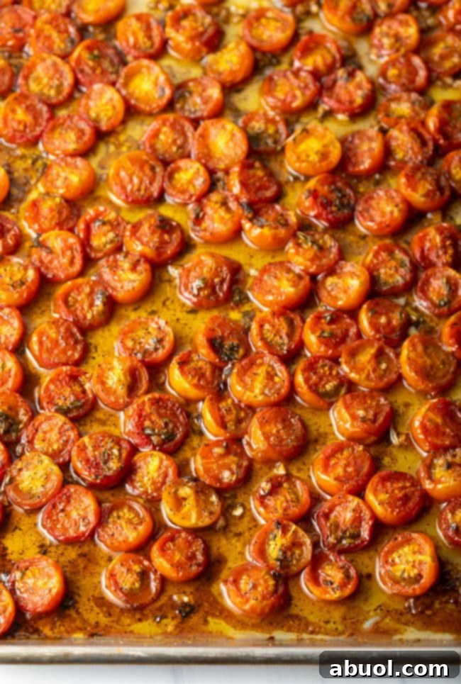 Overhead view of baking sheet with balsamic roasted tomatoes.