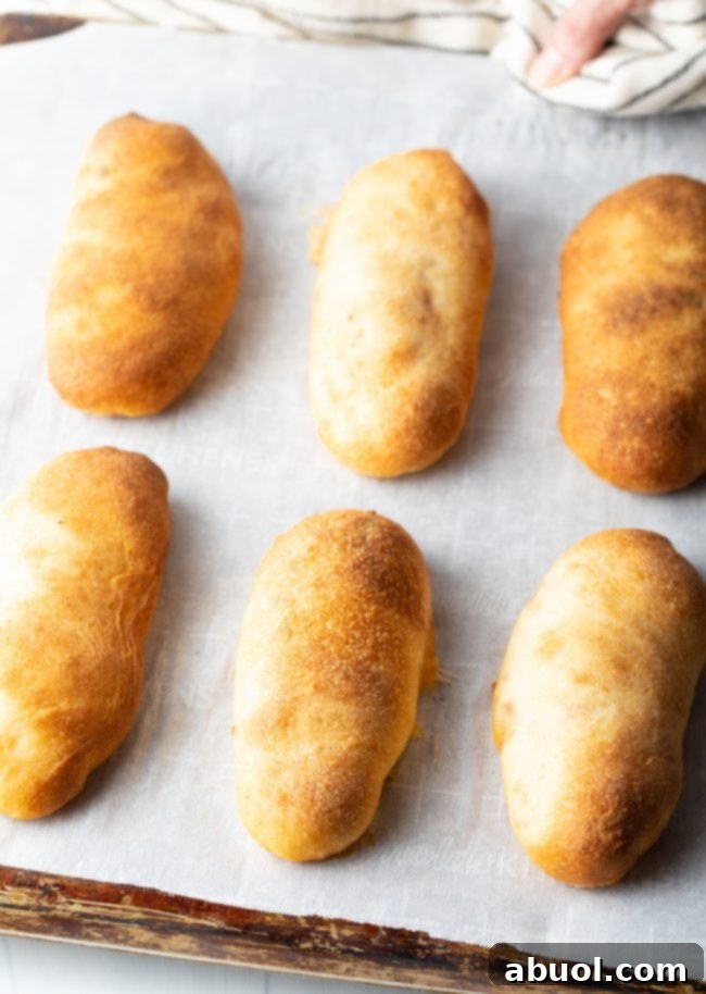 Baked pepperoni rolls on a pan.