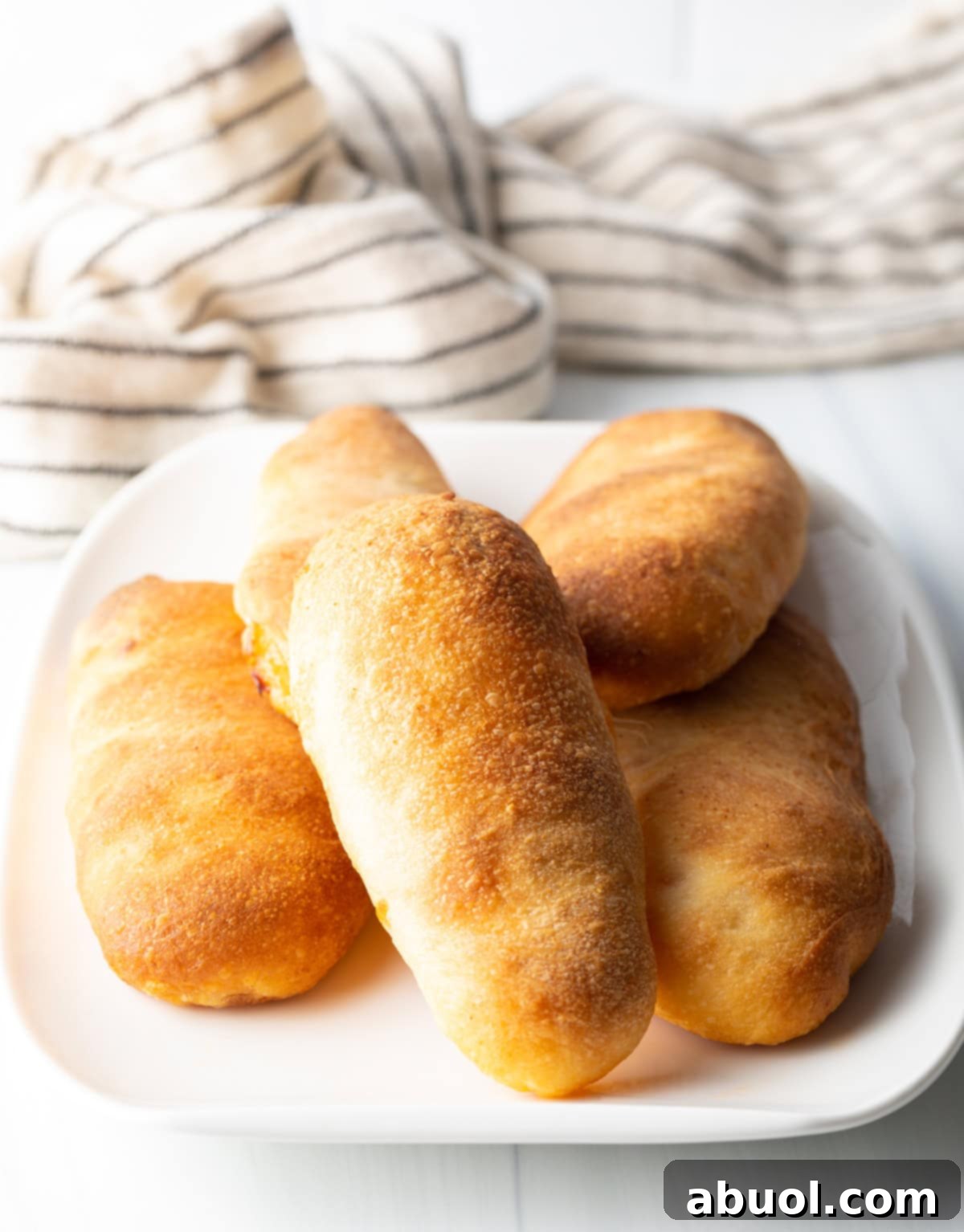 platter of homemade pizza pocket rolls stuffed with pepperoni and cheese