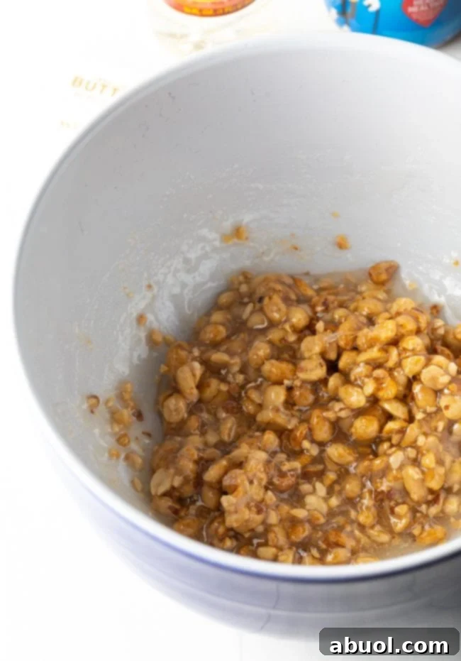 adding the nuts to the syrup and sugar mixture