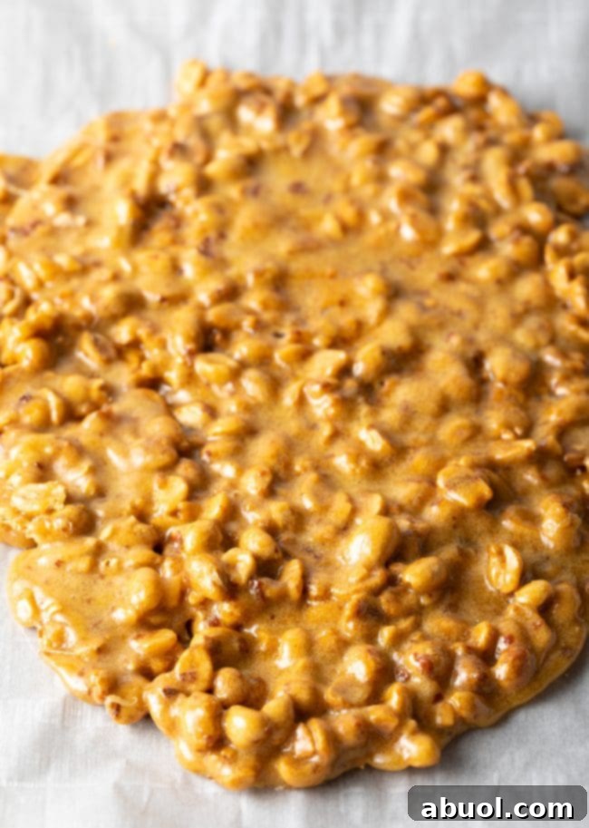 overhead view of microwave peanut brittle spread on parchment
