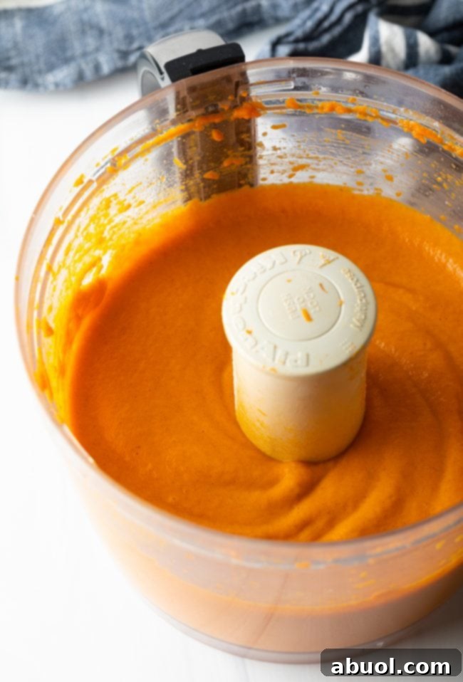 orange souffle mixture in a food processor