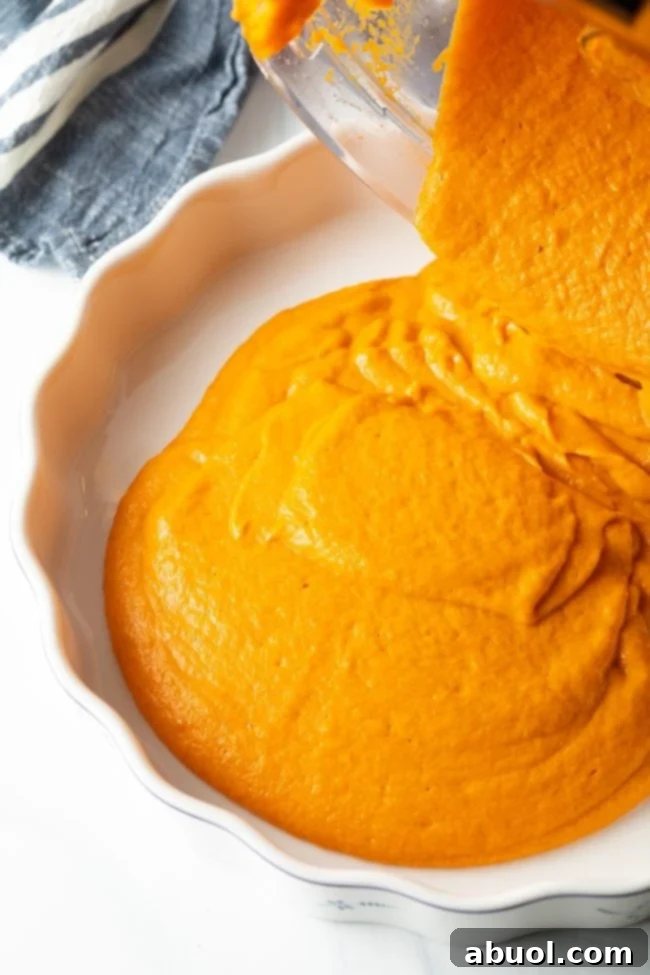 pouring the carrot mixture into a pan