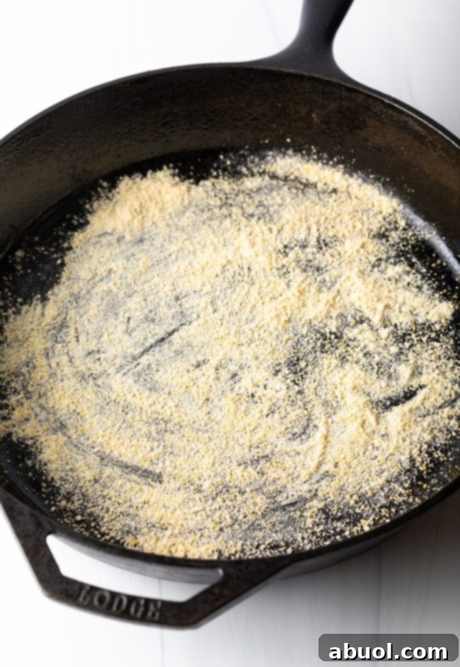 cast iron skillet dusted with cornmeal
