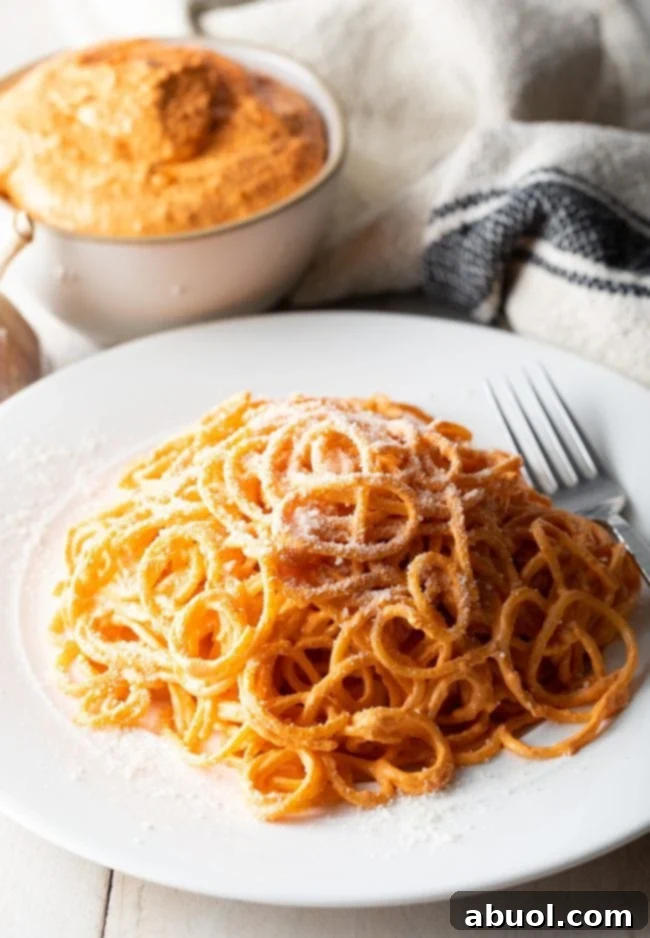 Fast Red Pepper Sauce served with toodles on a plate. 