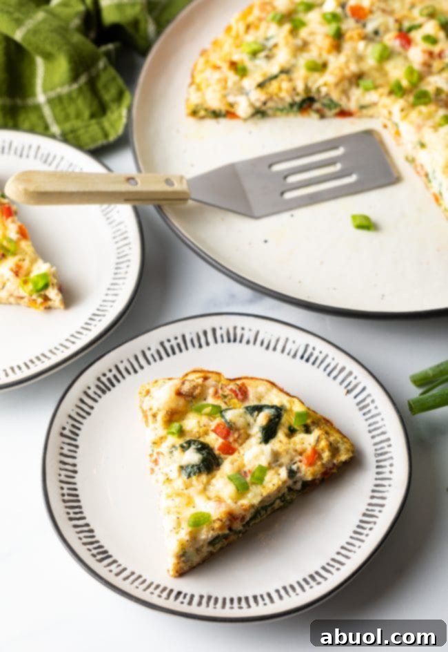 single slice of low carb frittata with egg white and veggies, perfect for a healthy diet.