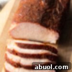 Ultimate Smoked Pork Loin Rub 12 Smoked Pork Loin Rub - finished smoked pork loin on a cutting board