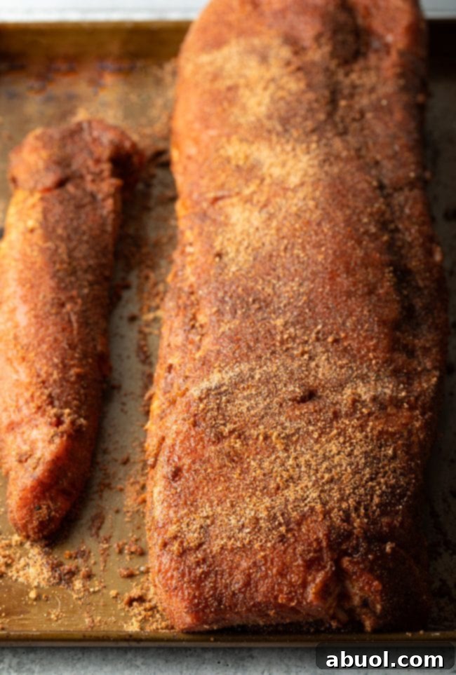 Ultimate Smoked Pork Loin Rub 6 pork loin crusted with spice rub, showcasing a thick, even coating