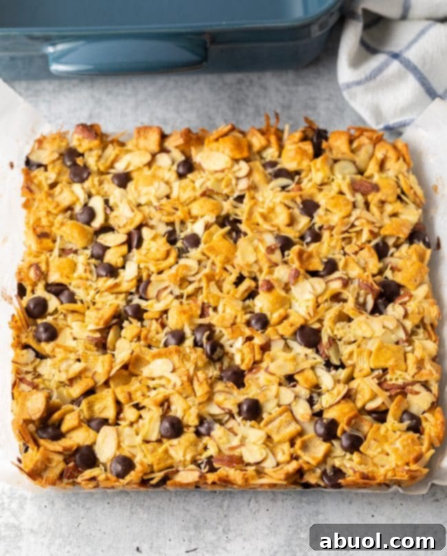 Low Carb Keto Cereal Snack Bars 8 Baked keto snack bars in a solid square, removed from the baking pan, showing the golden top and firm structure.