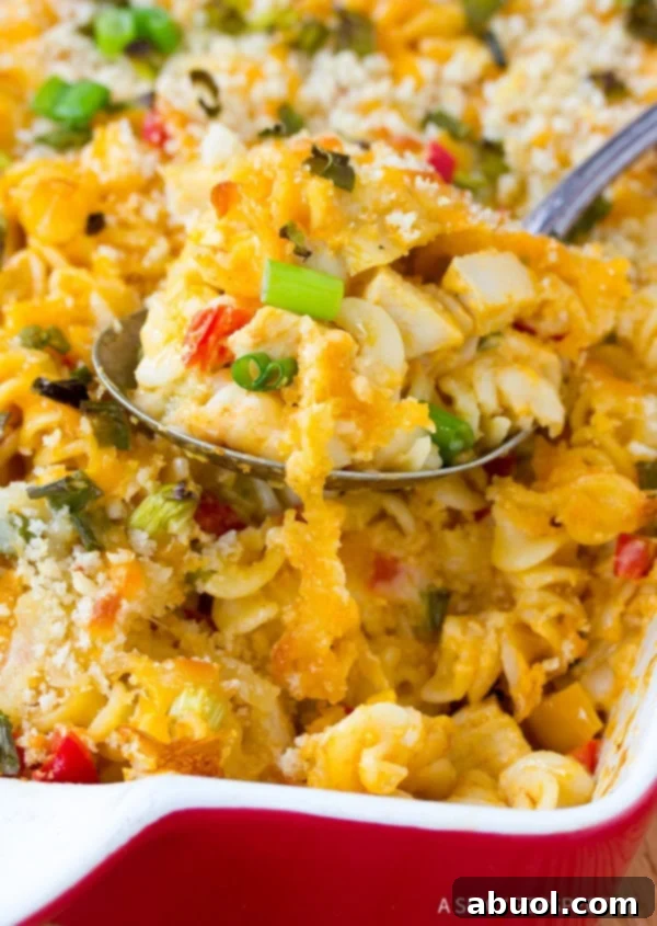 Creamy Mac and Cheese infused with buffalo flavor and tender chicken pieces, a comforting meal everyone will love.