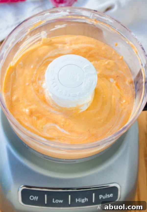A serving of hot and bubbly Buffalo Chicken Mac and Cheese, ready to be enjoyed.