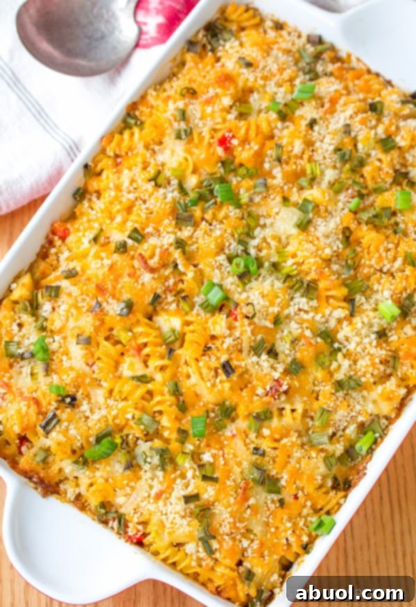 Close-up of baked macaroni and cheese with chicken, a perfect hearty meal.