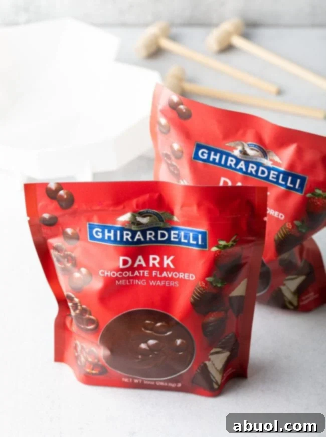 Two bags of premium Ghirardelli dark chocolate melting wafers, showcasing the ideal ingredient for a glossy and sturdy breakable chocolate heart.
