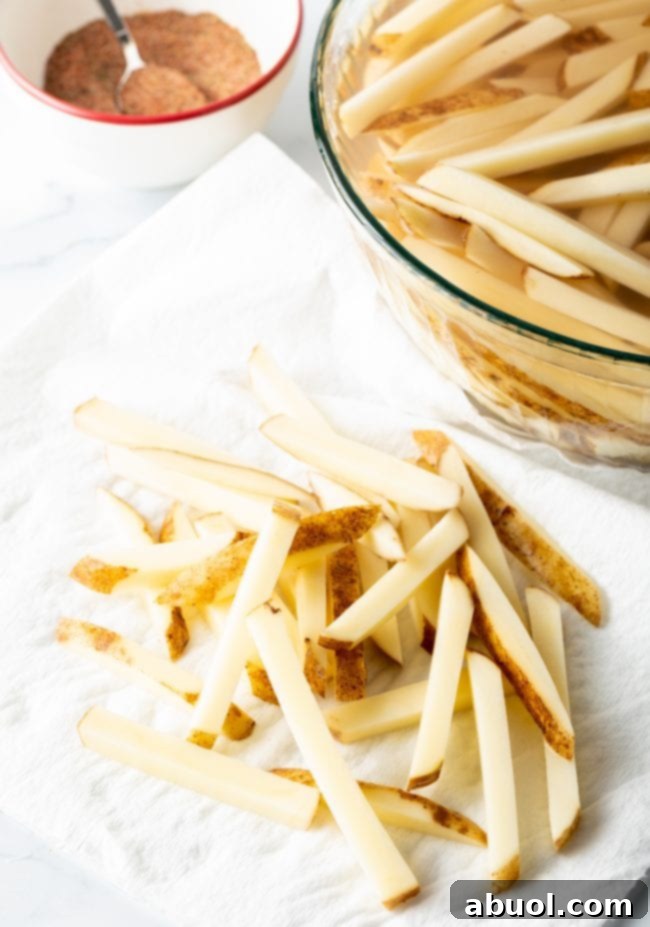 Sliced potatoes on a white towel.