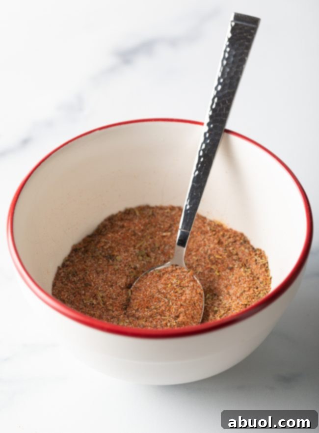 Spoon mixing spices together.
