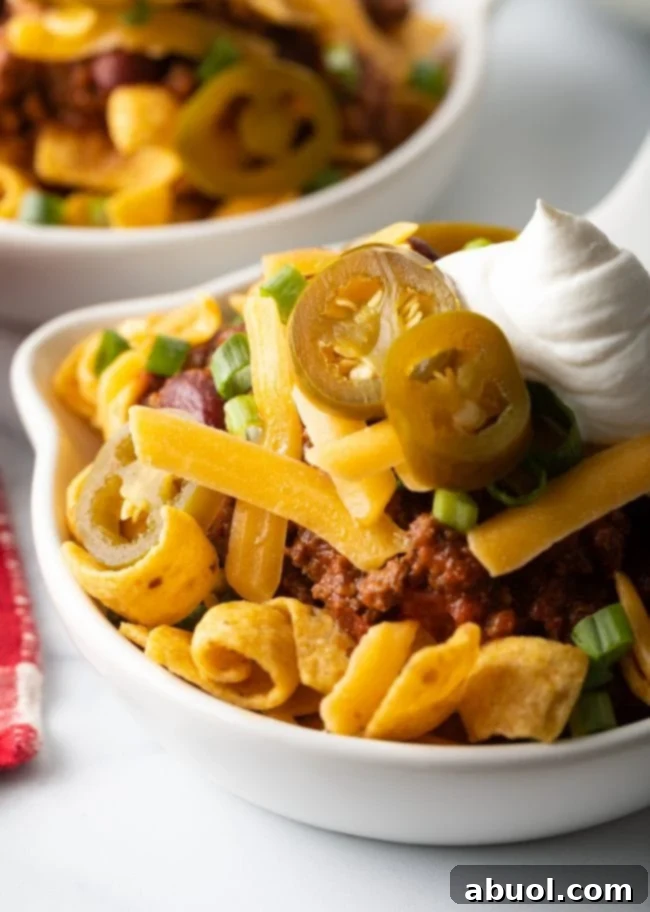 Close view of frito chili pie in a shallow bowl.