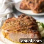 A perfectly smoked pork chop, tender and juicy.