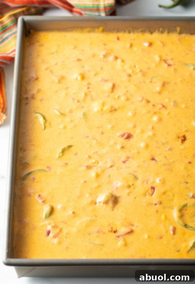 top view smoked queso chorizo dip in a metal pan
