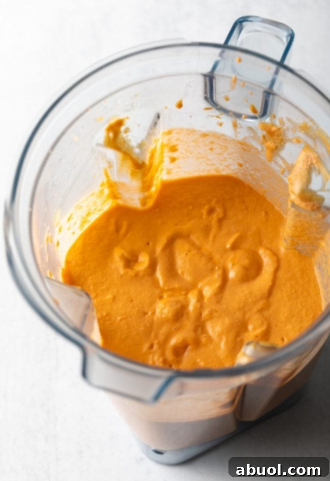 The blended creamy base mixture, smooth and rich, inside a blender jar, prepared for the Maafe soup.