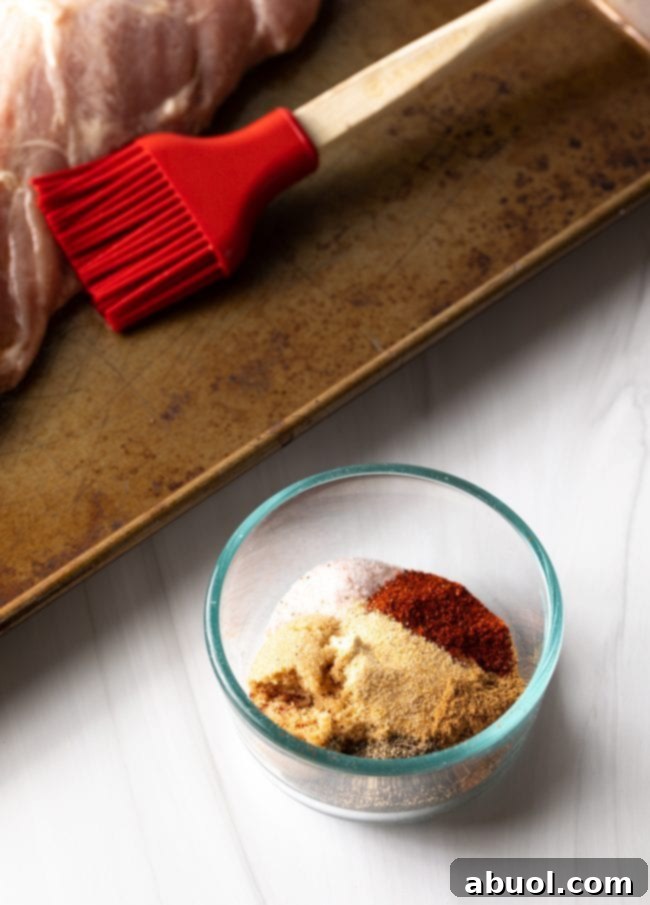 A small glass bowl filled with the mixed spice rub ingredients, ready to be applied.