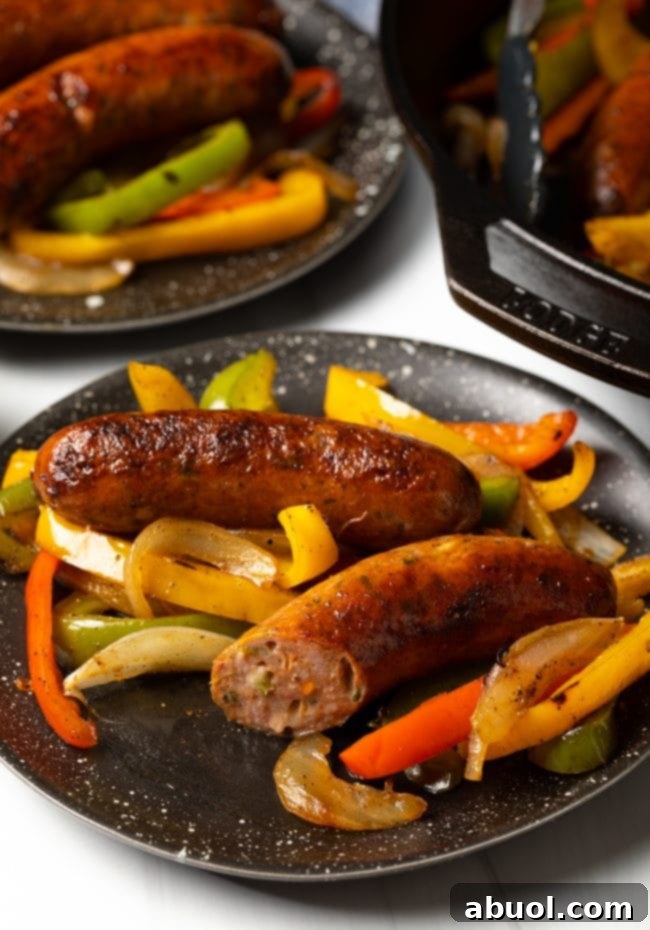 Plated Italian sausages on a dish with a slice removed. 