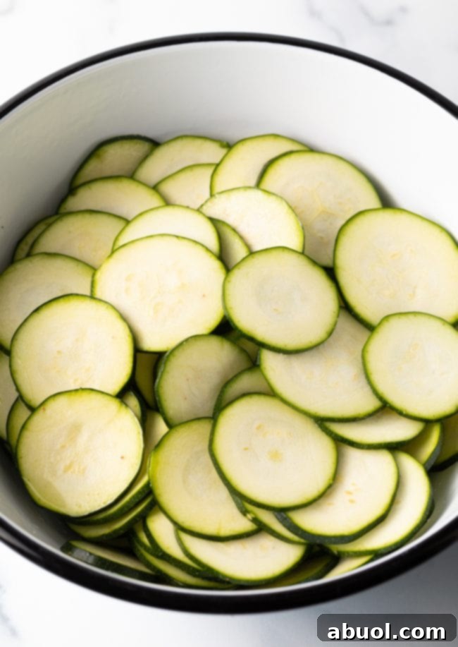Crispy Air Fryer Zucchini Crisps 6 Bowl of sliced zucchini rounds.