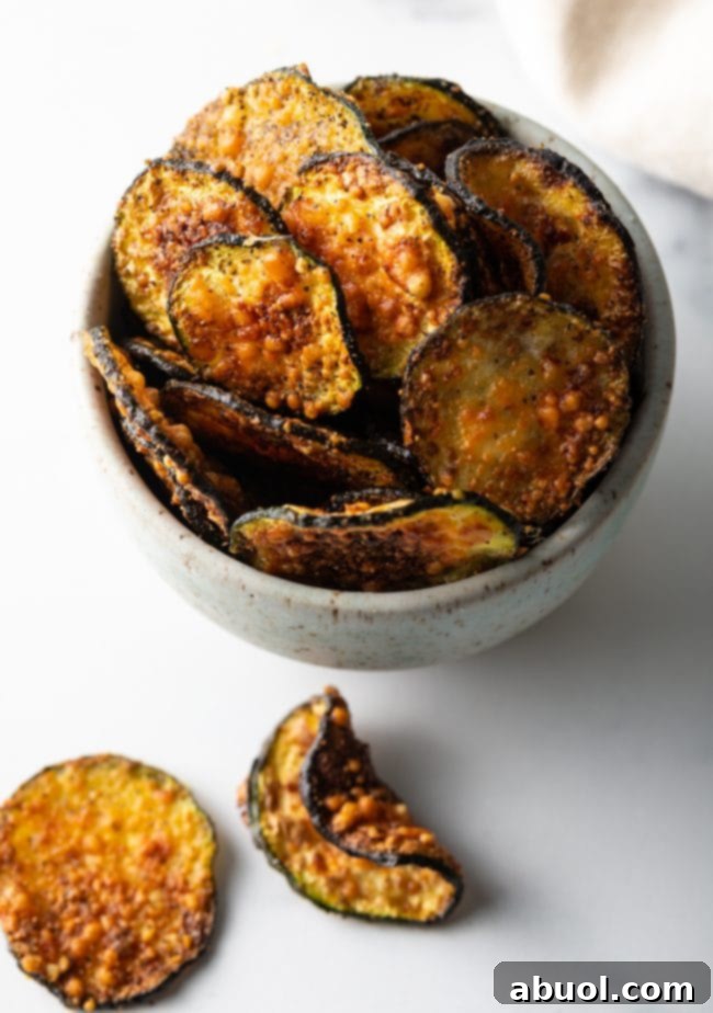Crispy Air Fryer Zucchini Crisps 10 Top down view of bowl with chips.