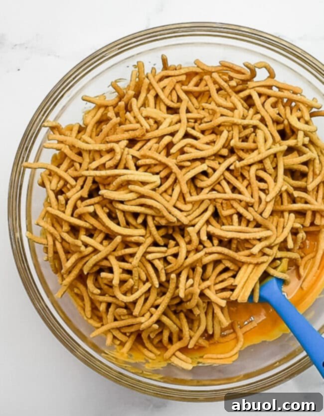 add chow mein noodles to melted mixture