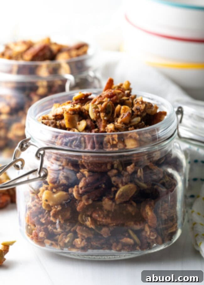 Ultimate Keto Granola Crunch 3 Close view of side of glass jar of keto granola.