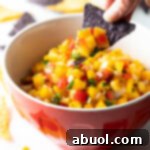 A small bowl of Peach Mango Habanero Salsa