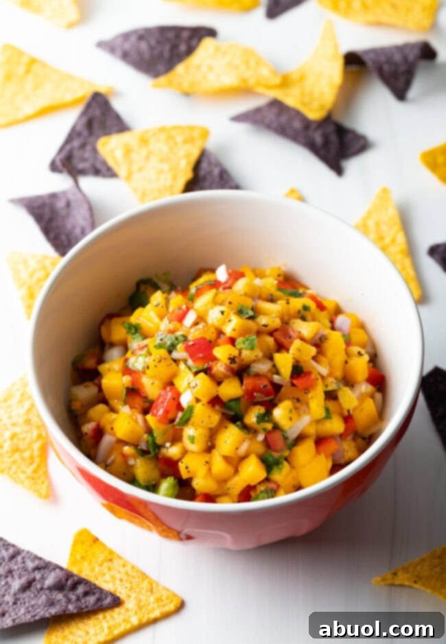 Mango habanero pico de gallo presented beautifully in a serving bowl, garnished with fresh cilantro.