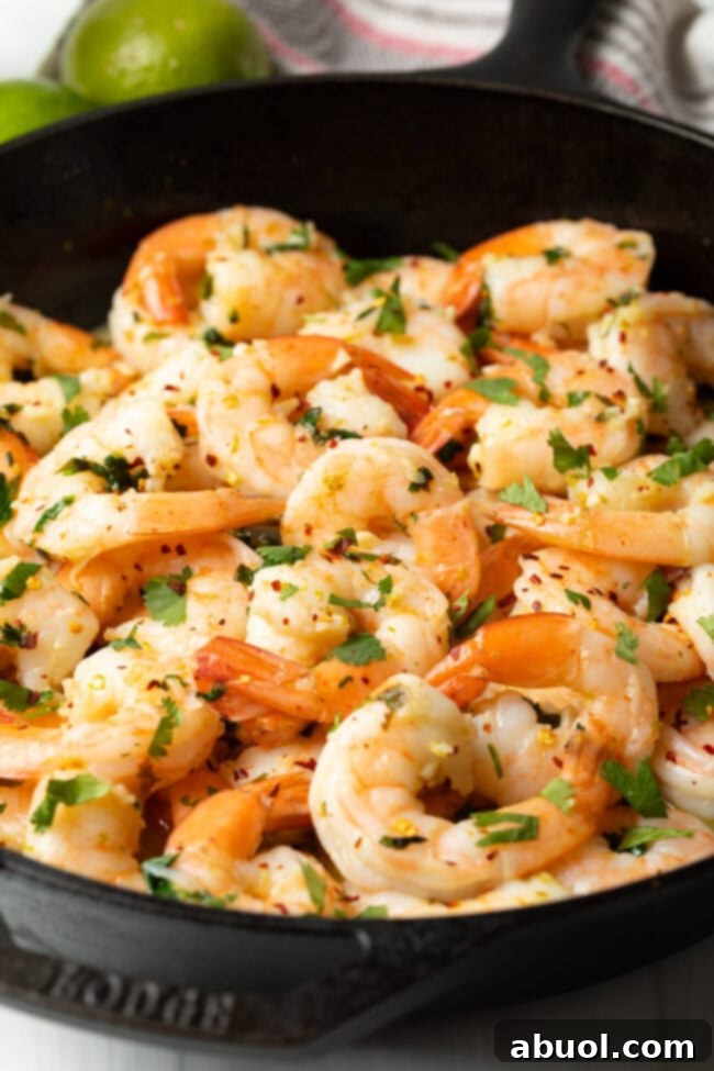Tequila lime shrimp glistening in a skillet, ready to be served.