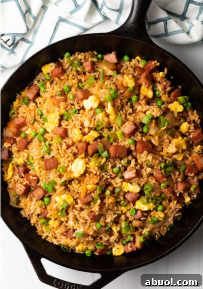 Top down view spam fried rice recipe with kimchi finished.