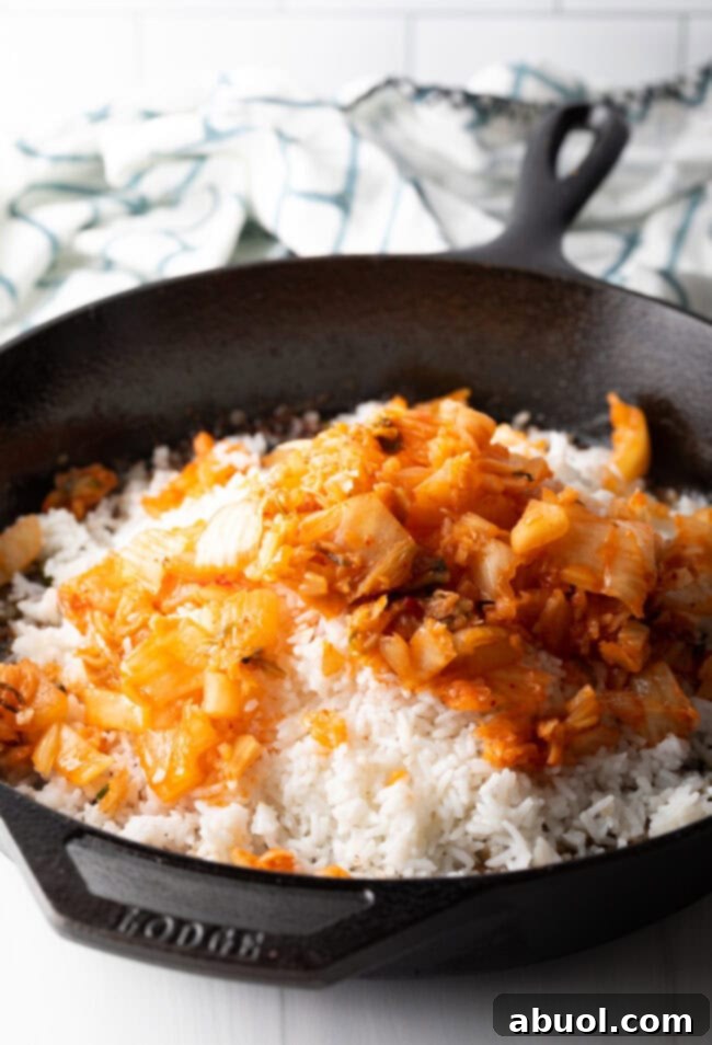 Skillet with rice and chopped kimchi.