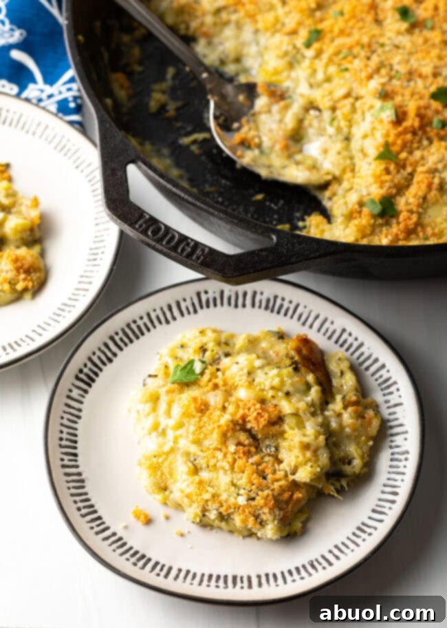 Top-down view of zucchini and cheese casserole servings on a plate.
