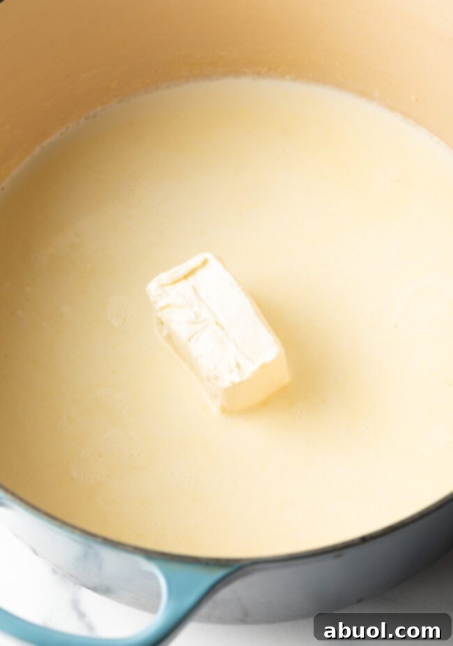 Butter melting in a large dutch oven on the stovetop.