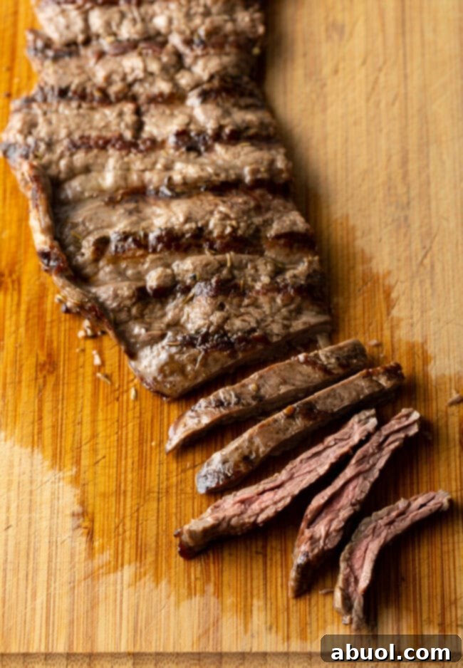 sliced steak on Mexican cutting board