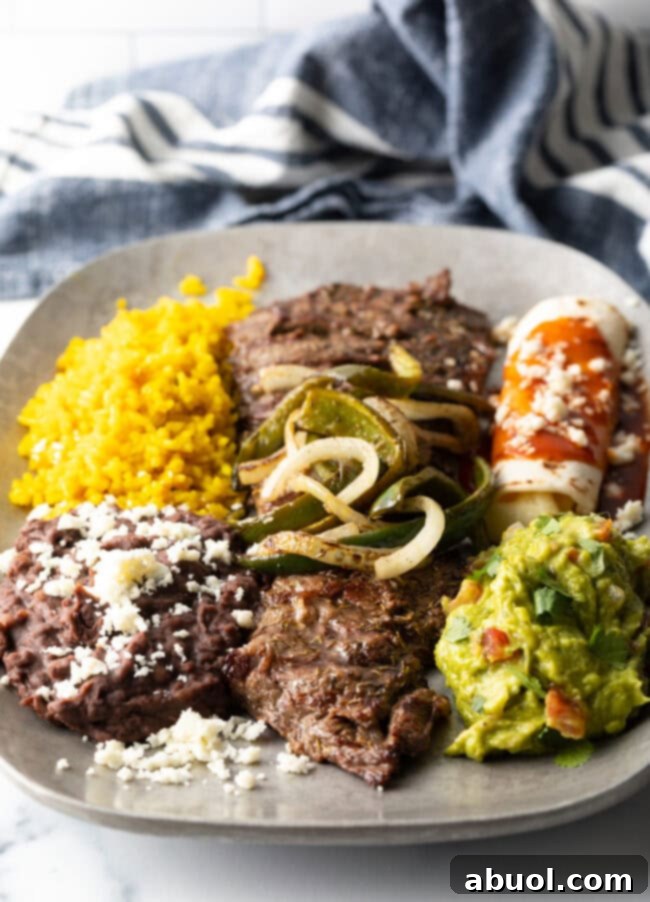 Mexican Steak Tampiquena on platter with all traditional side dishes