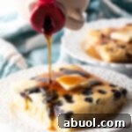A close-up of a stack of fluffy sheet pan pancakes.