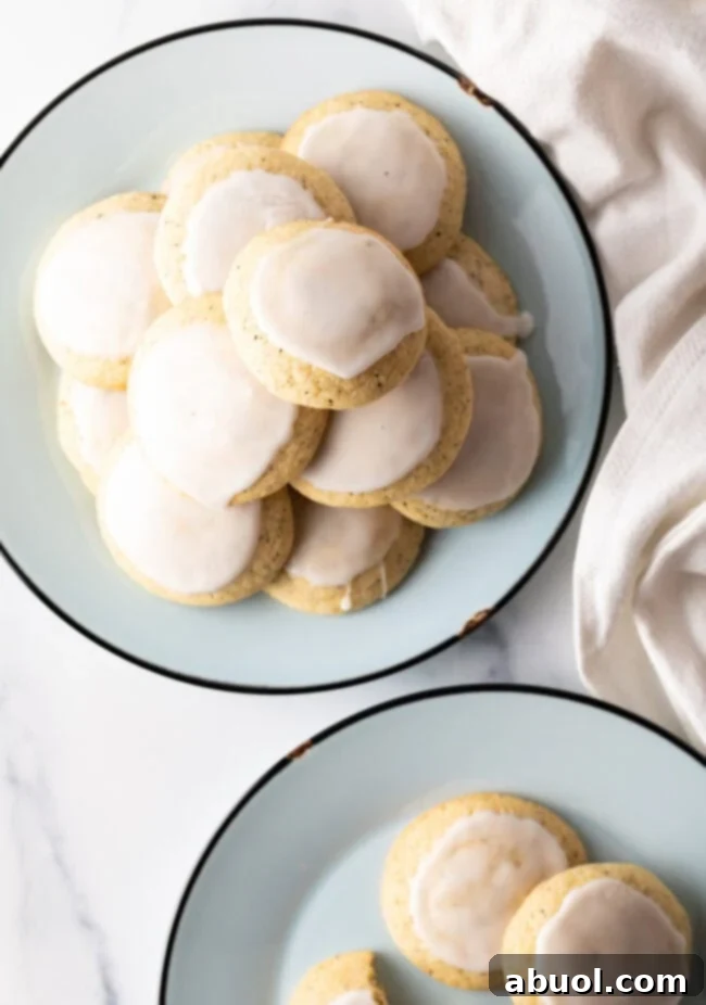 Plates stacked with freshly glazed Earl Grey tea cookies.