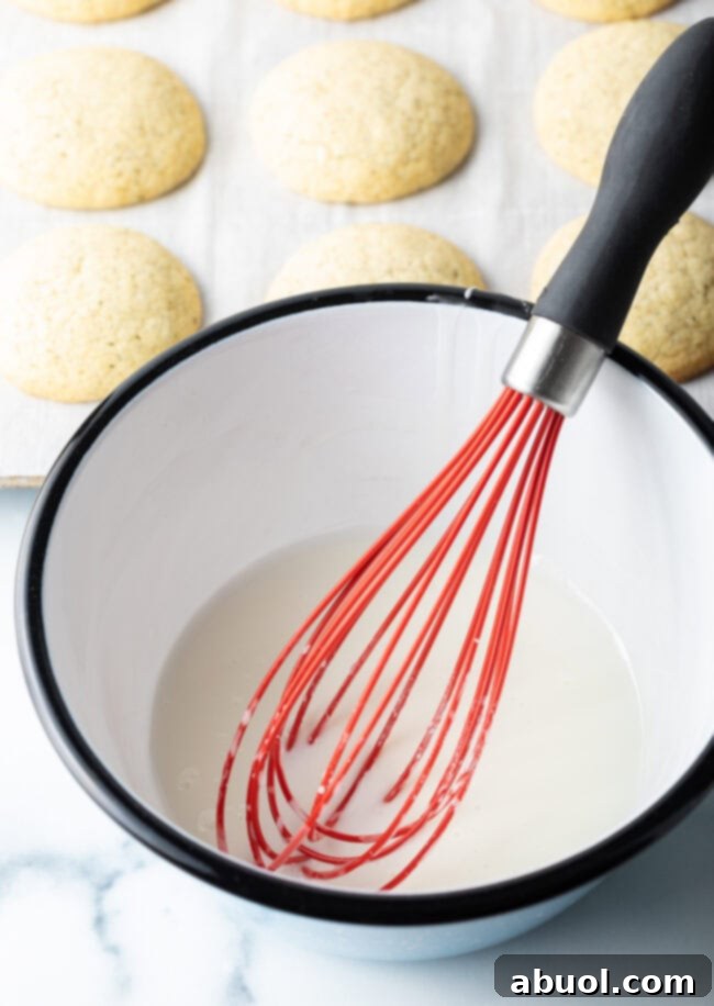 Mixing dry ingredients into the wet batter.