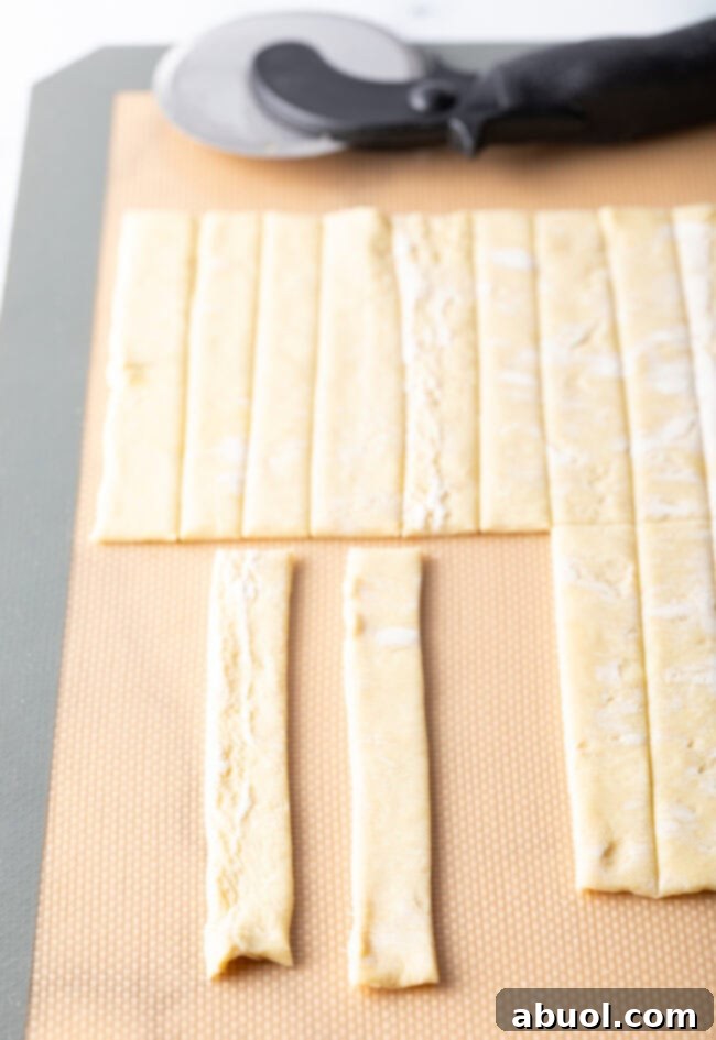 Two neatly sliced pieces of puff pastry, ready for shaping.