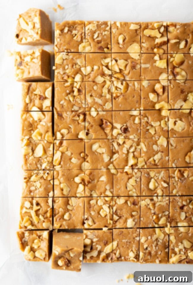 Top down view maple fudge cut into small squares.