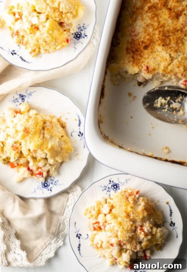 Golden Cheesy Hominy Bake 3 Top down view three servings on casserole on plates.