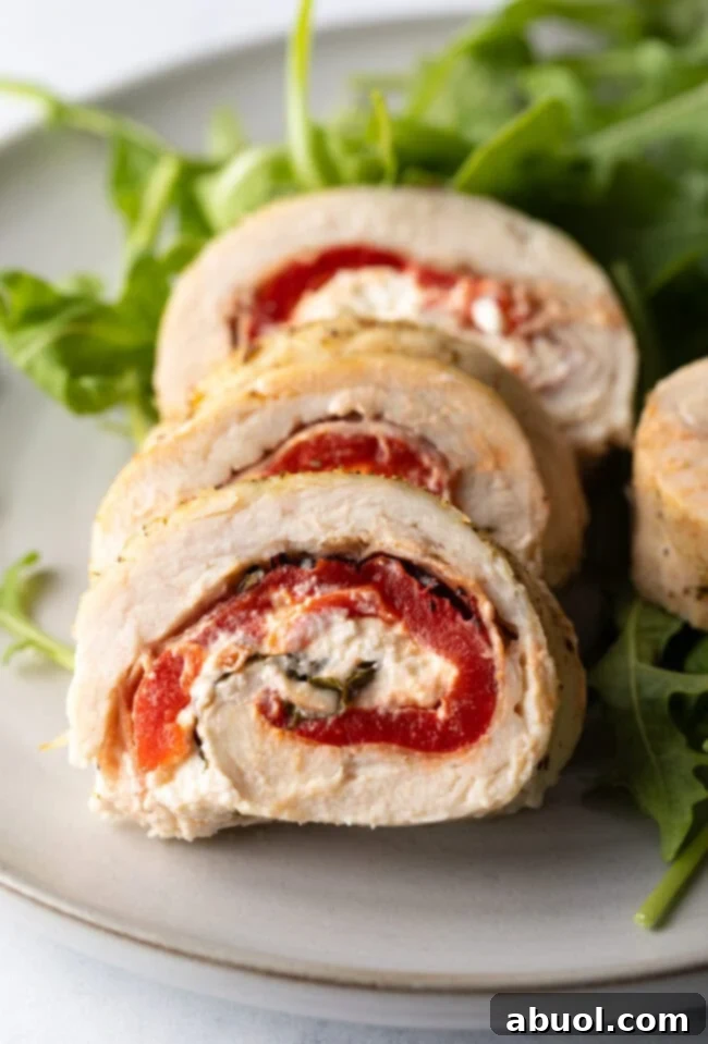 Close view pieces of chicken roulade on a plate.