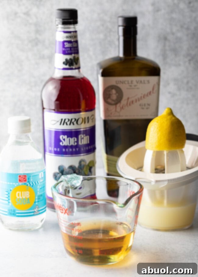 Ingredients you need: Gin, lemon juice, club soda, and simple syrup.
