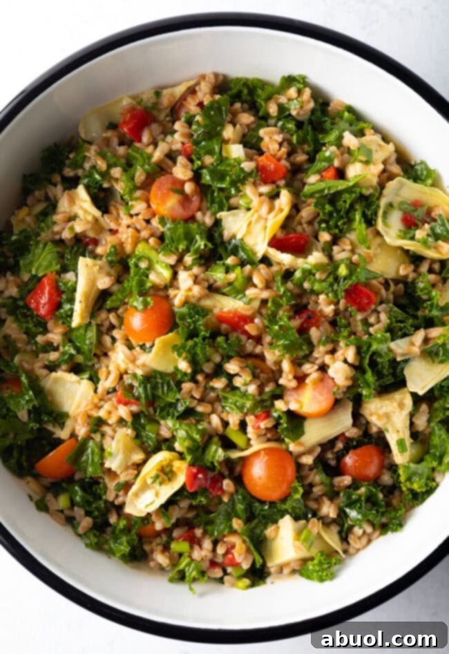 Top down view kale and Farro salad in a large bowl.