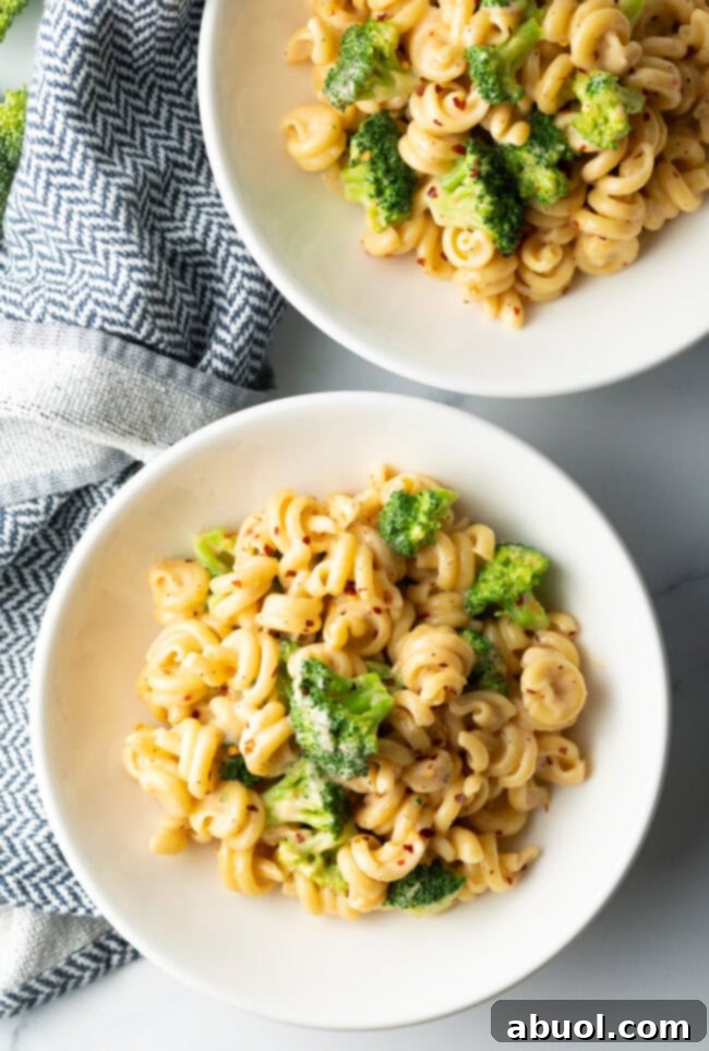 Perfectly Creamy Broccoli Pasta 3 Top down view two bowls of broccoli pasta.