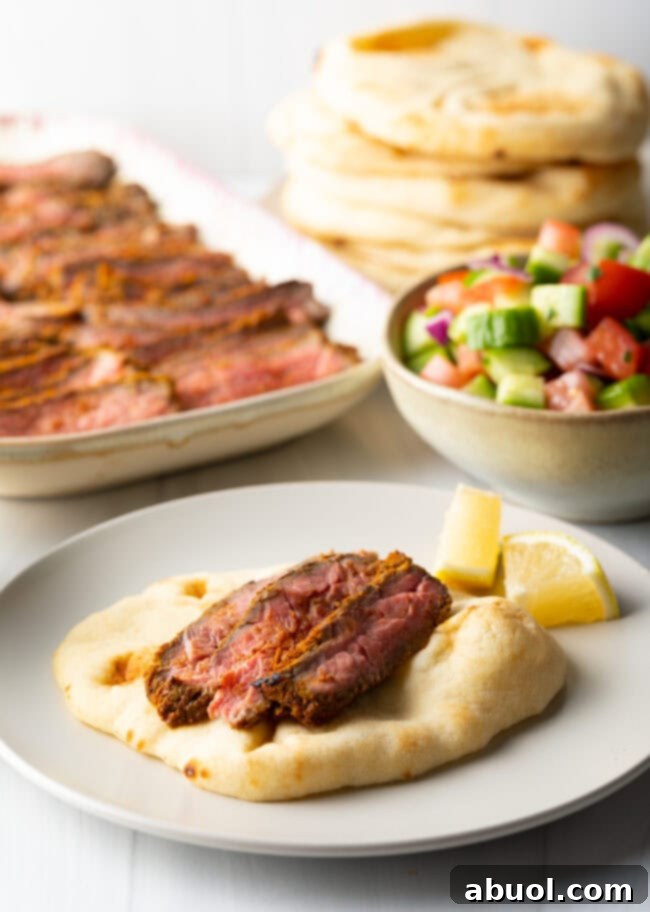 Savory Spiced Beef Shawarma 11 Flatbread on plate with slices of beef.