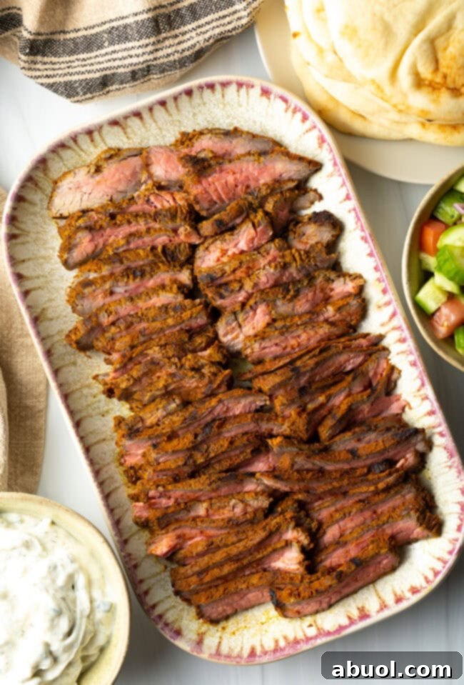 Savory Spiced Beef Shawarma 3 Top down slices of beef shawarma on a serving platter.